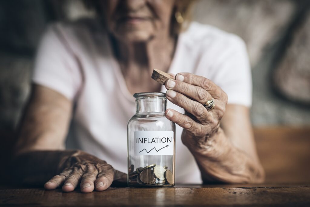 Elderly retired woman and her savings in a jar