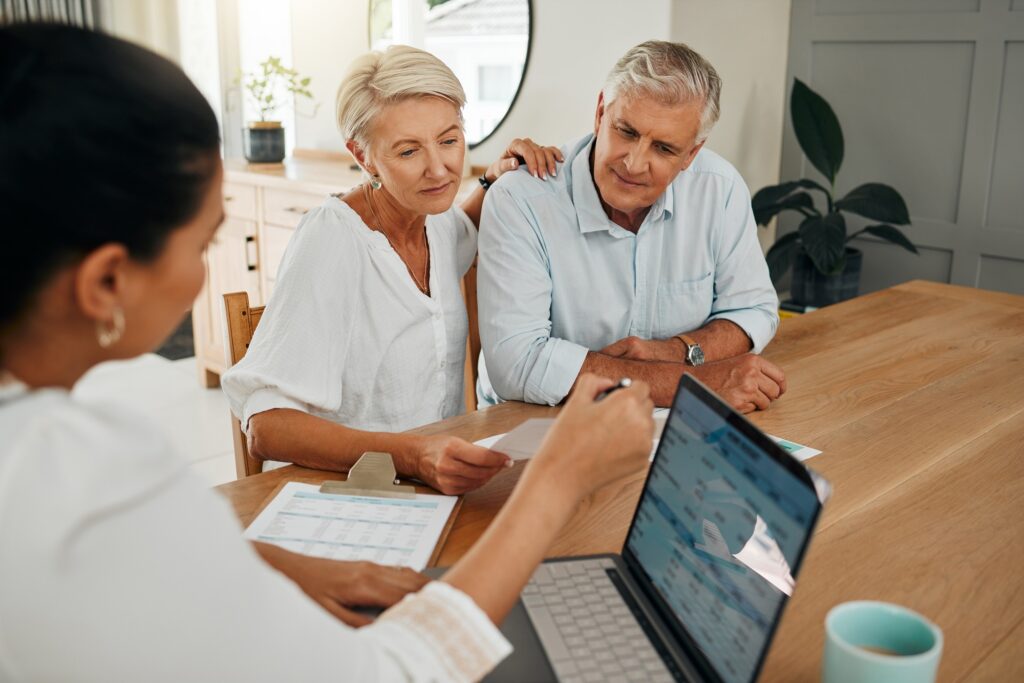 Financial advisor consultation with clients on retirement, finance planning or investment and document on laptop screen. Accountant woman, senior people and pension advice, asset management or budget.